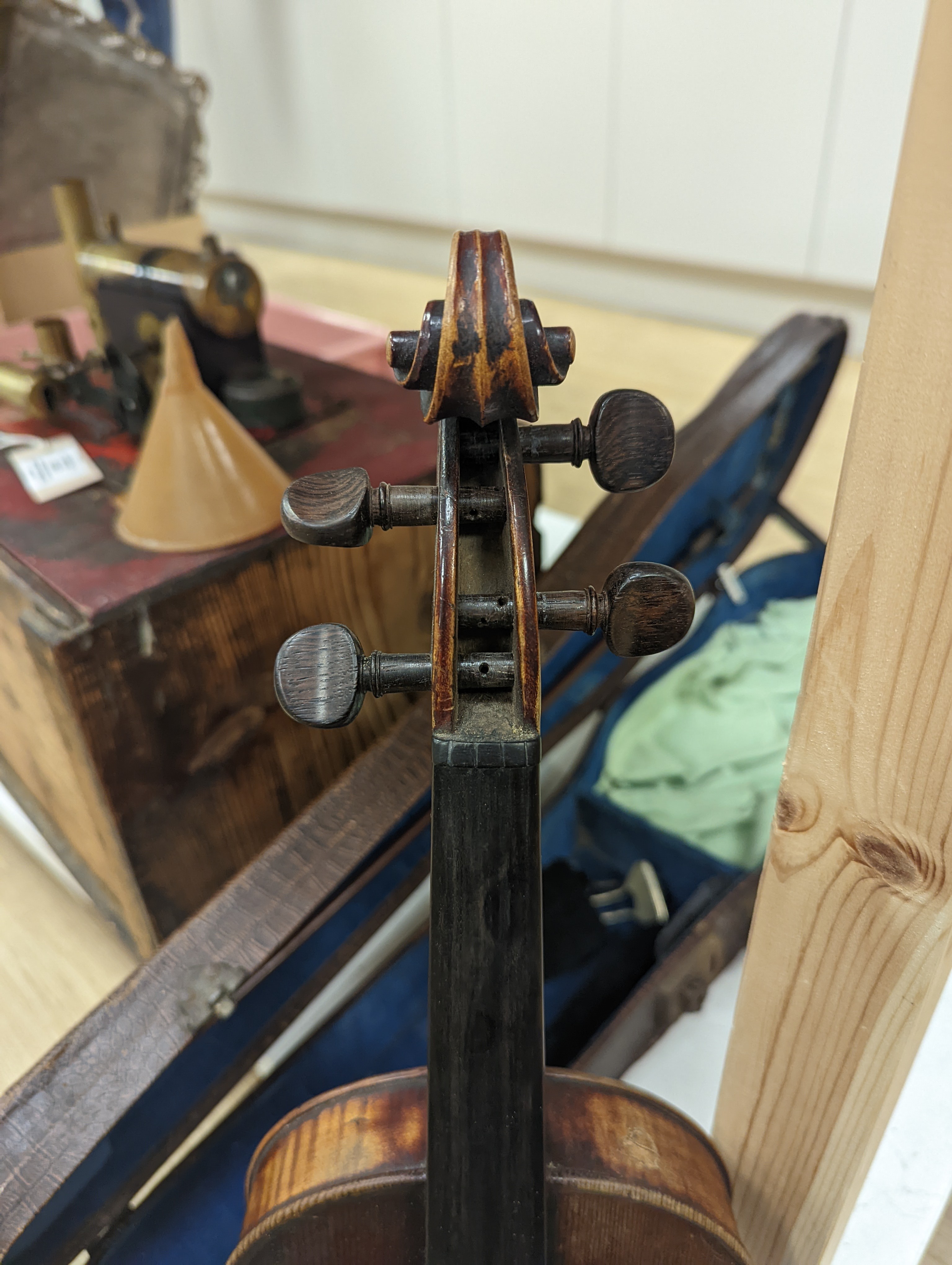 A late 19th century German violin and two bows, cased
